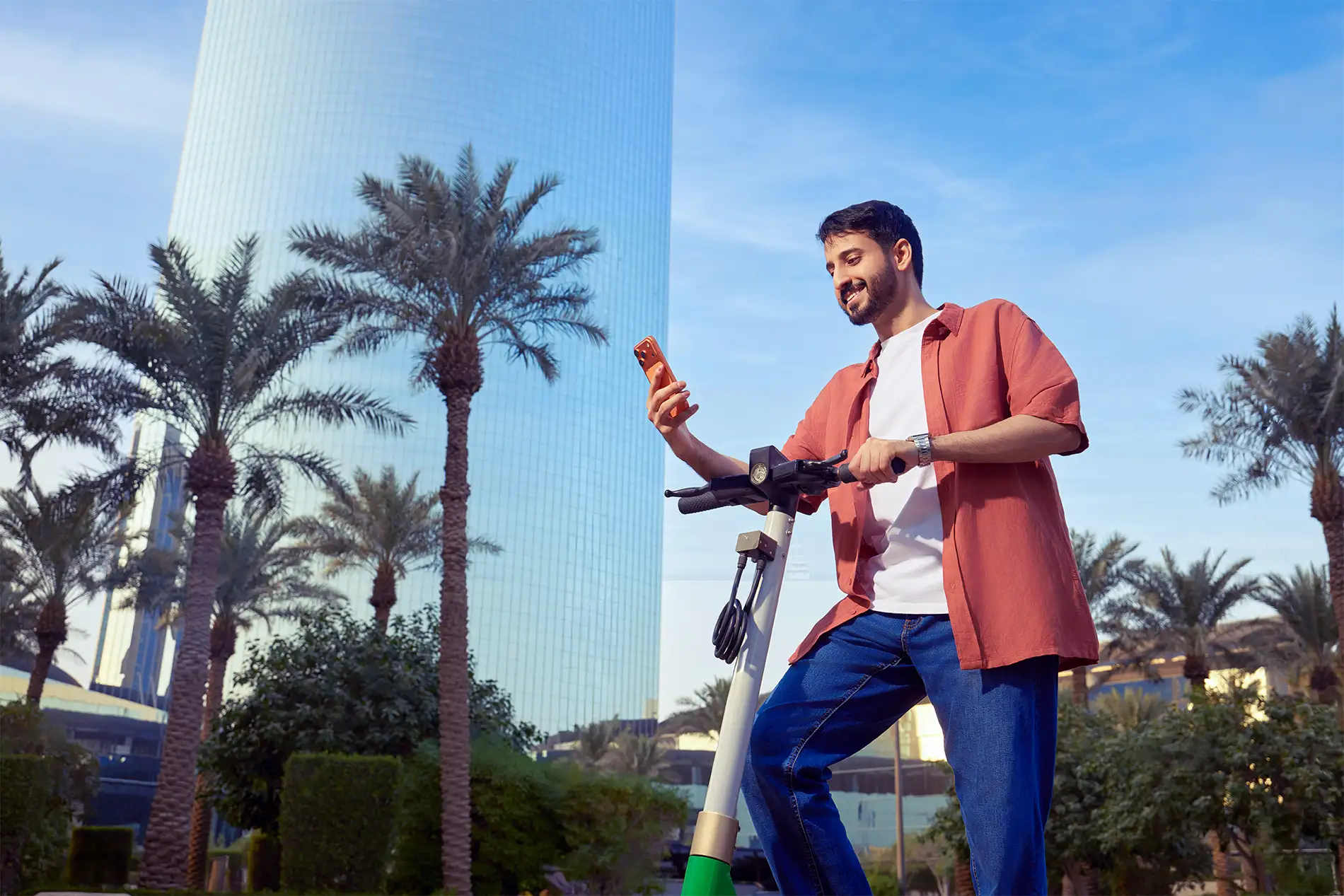 Mobily customer using mobile services in an urban outdoor setting