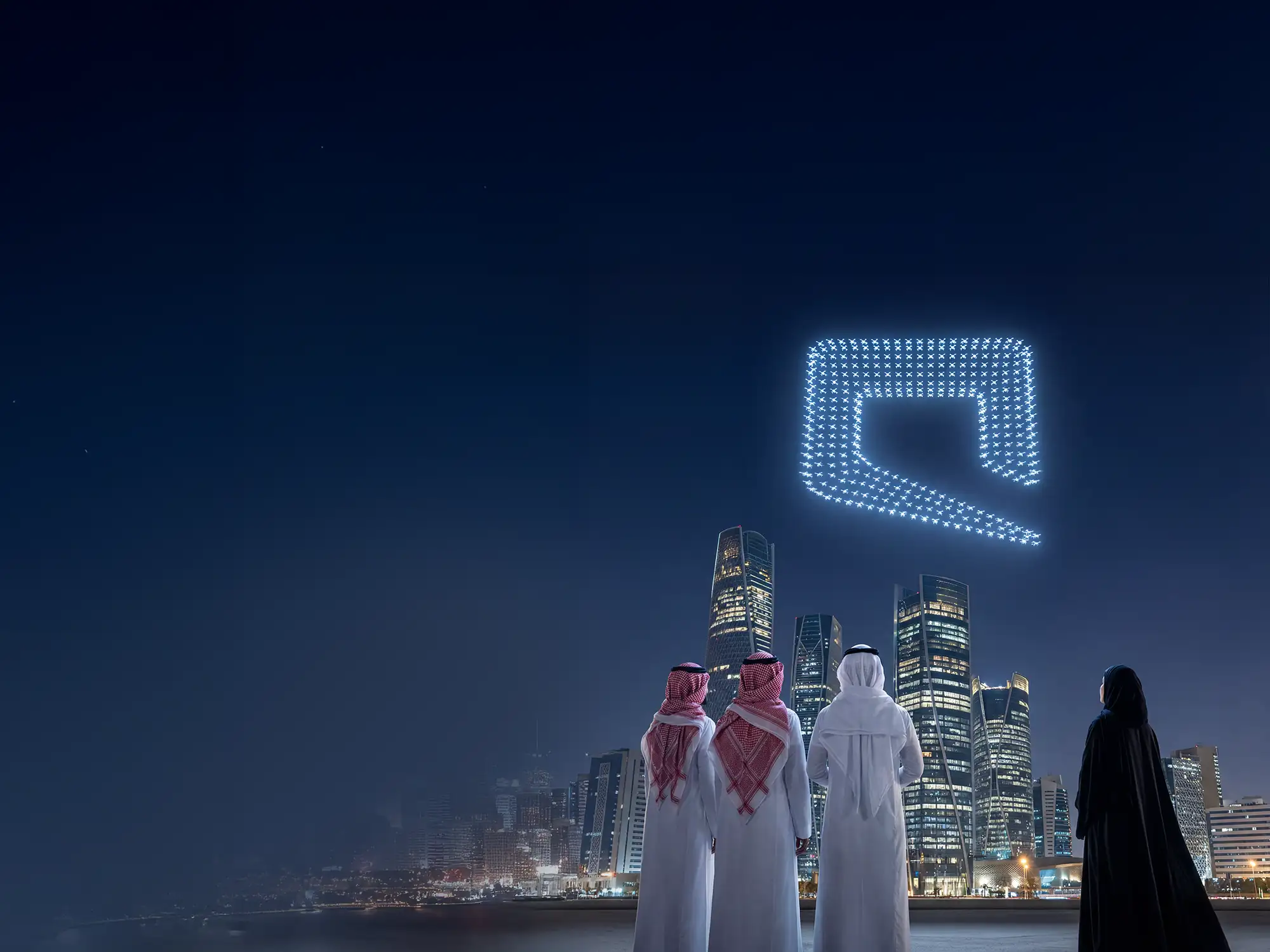 Riyadh skyline at night with Mobily logo formed by lights; stakeholders view the city.